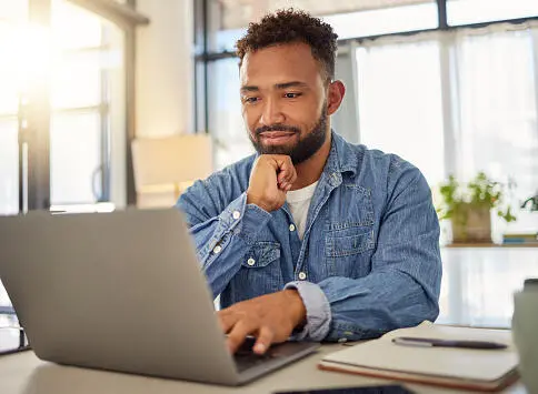 A user testing the prototype on a laptop